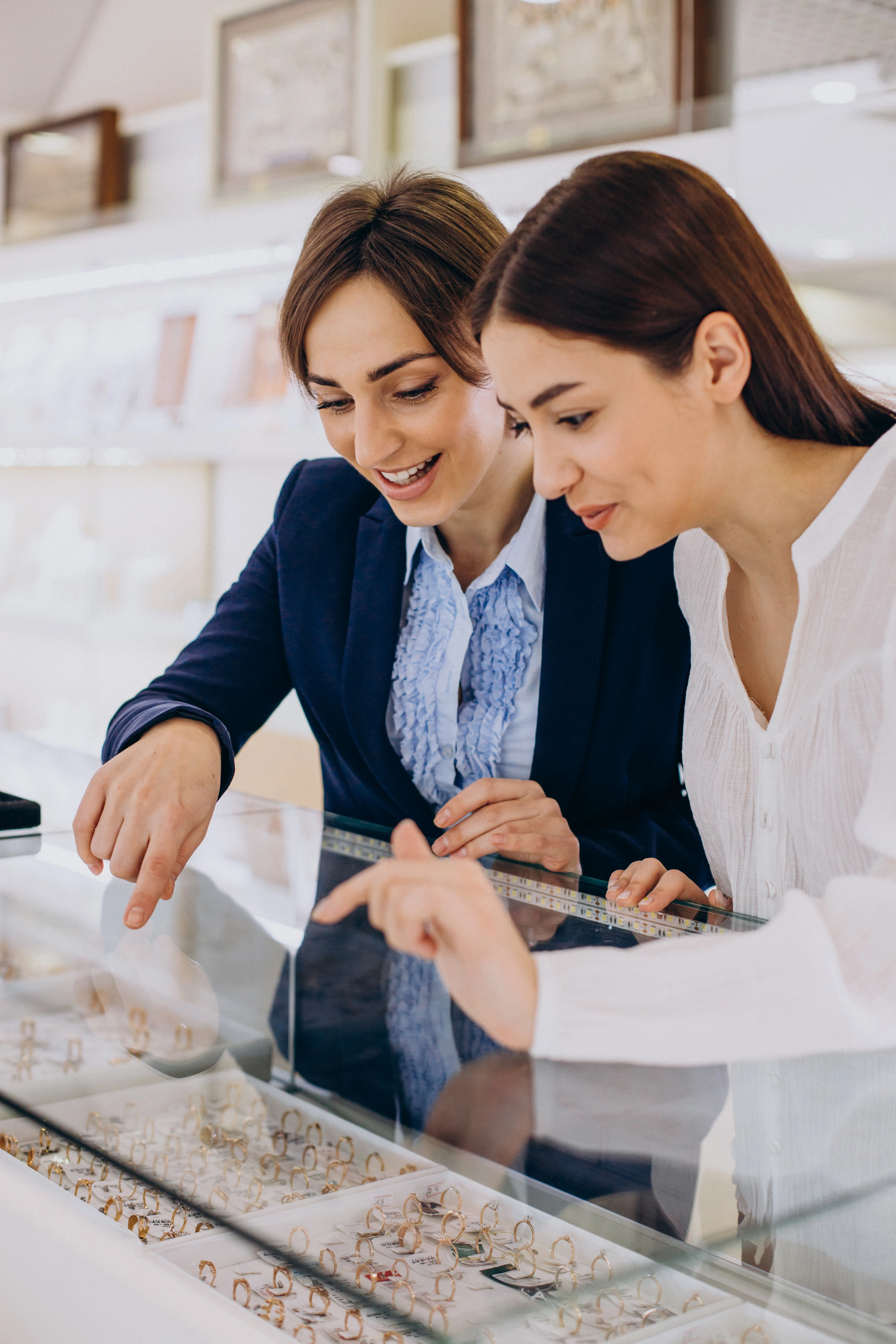 Jewellery consultant helping customer select jewellery